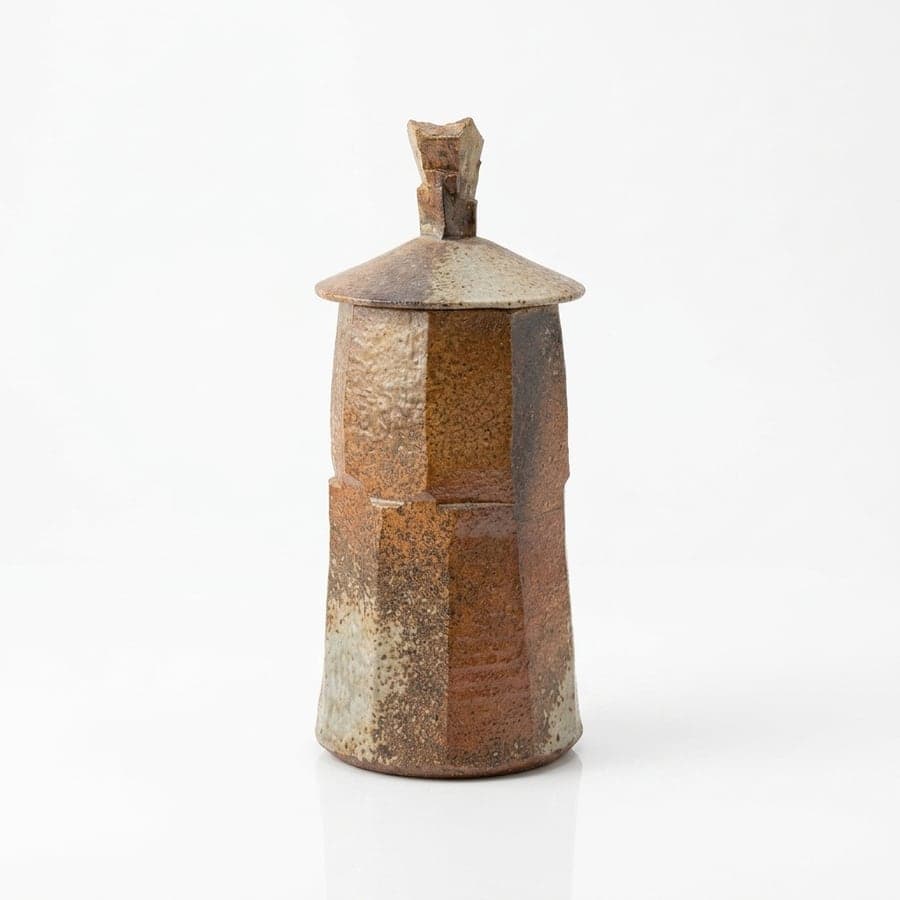 The same ceramic jar photographed against a plain white background